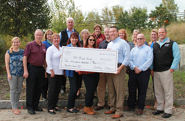 Group of Verani agents presenting check to New Hampshire Food Bank